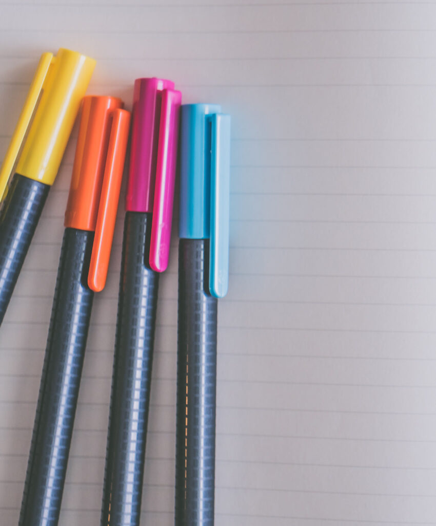 Colored pens on lined notebook paper