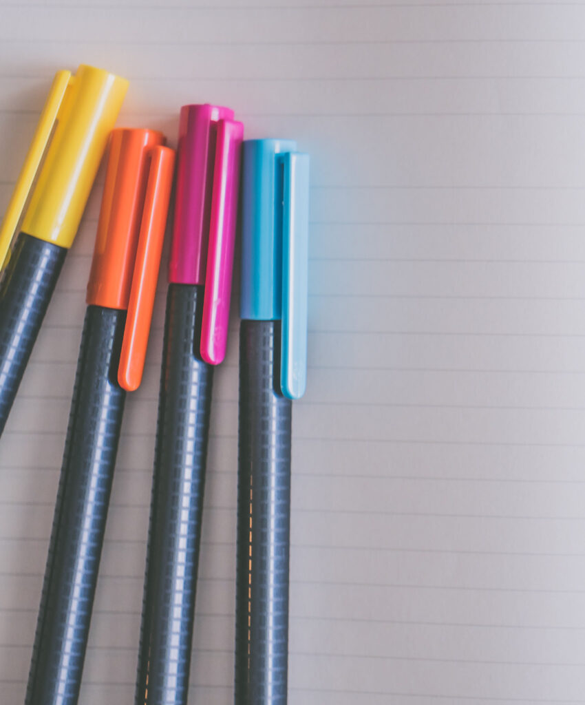 colorful pens on paper